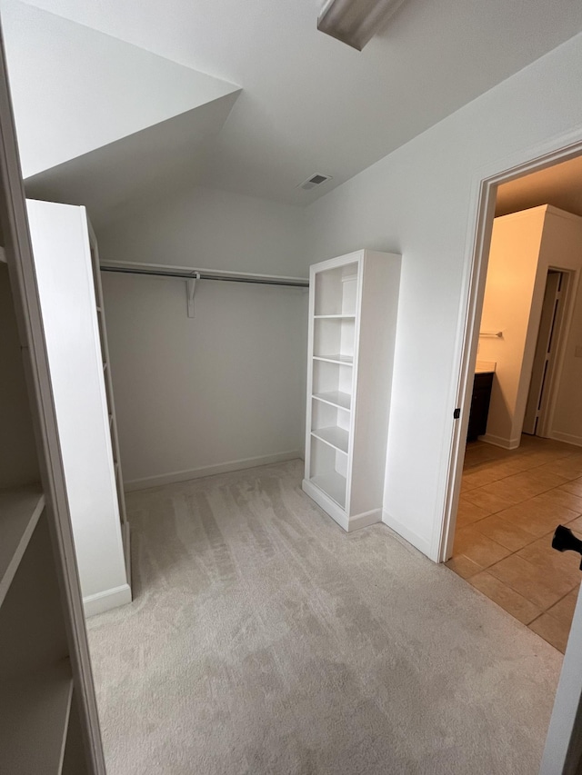 2010 Katach Ct, Spring Hill, TN 37174 - unfurnished bedroom featuring light carpet, light tile patterned flooring, and a closet