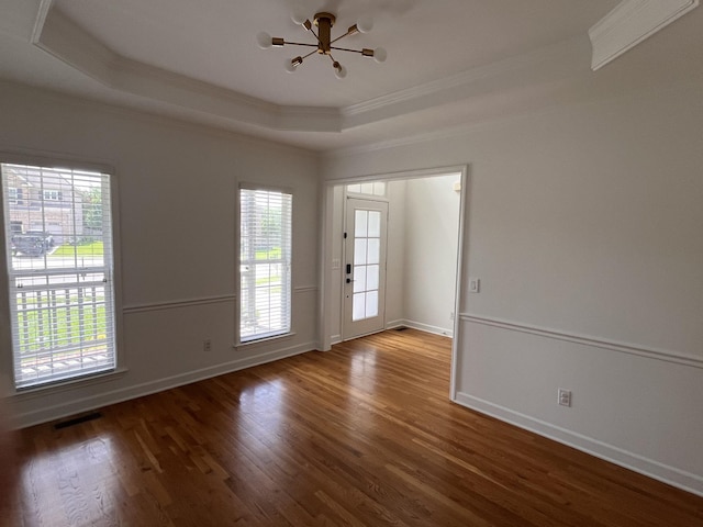 2010 Katach Ct, Spring Hill, TN 37174 - unfurnished room with ornamental molding, a chandelier, a tray ceiling, wood finished floors, and healthy amount of natural light