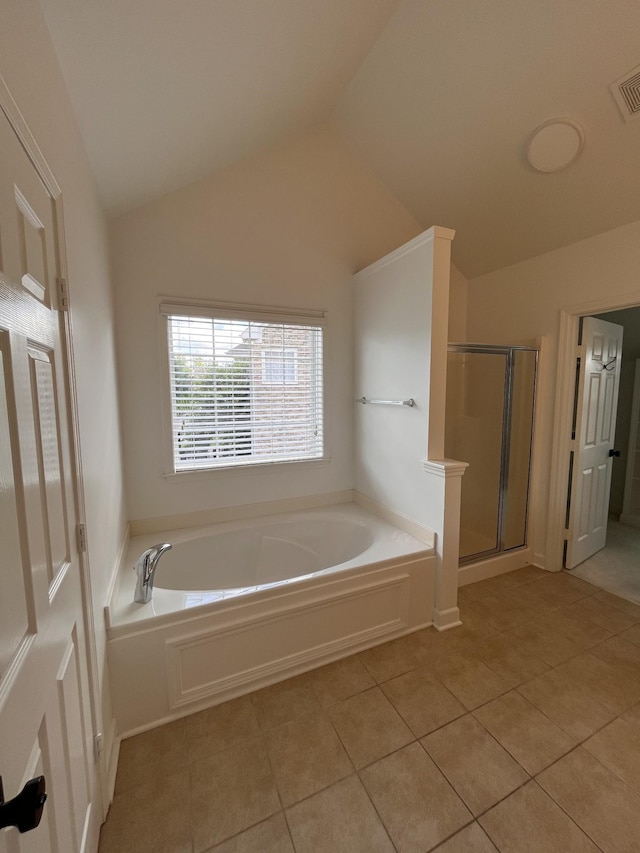 2010 Katach Ct, Spring Hill, TN 37174 - full bath featuring a garden tub, tile patterned floors, vaulted ceiling, and a shower stall
