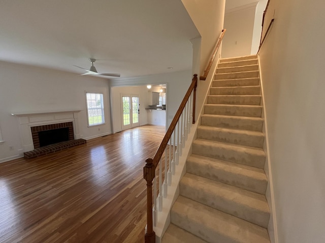 2010 Katach Ct, Spring Hill, TN 37174 - stairway featuring a ceiling fan, wood finished floors, and a fireplace