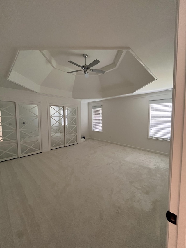 2010 Katach Ct, Spring Hill, TN 37174 - unfurnished bedroom with a tray ceiling, carpet flooring, and a ceiling fan
