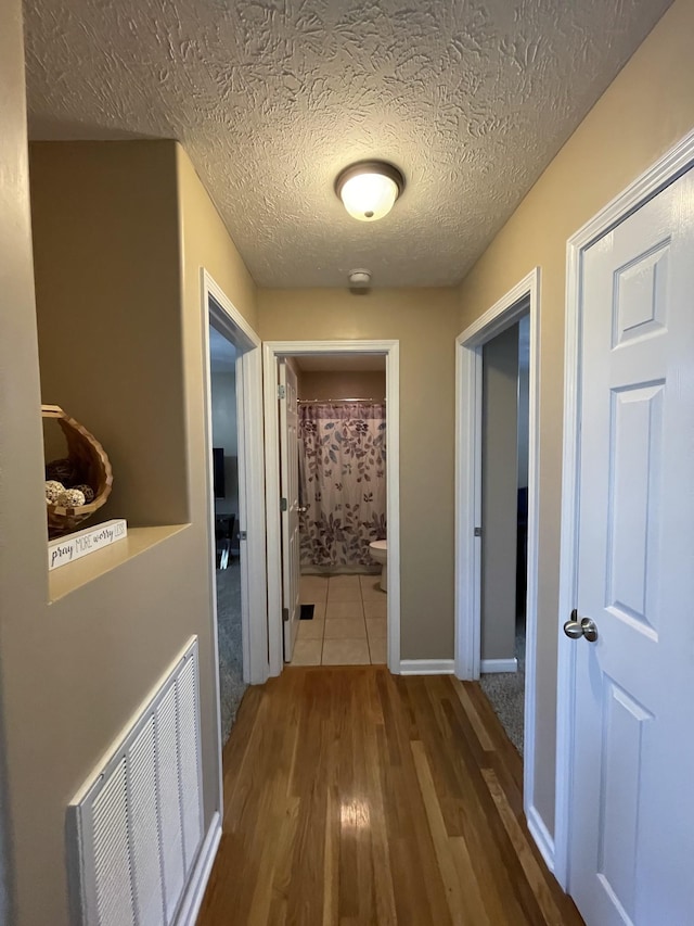 532 Douglas Ln, Lafayette, TN 37083 - hall with wood finished floors and a textured ceiling
