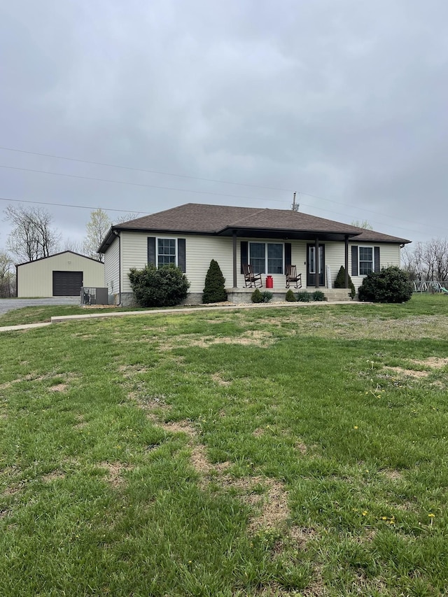 532 Douglas Ln, Lafayette, TN 37083 - ranch-style home featuring a detached garage, a front lawn, covered porch, and an outbuilding