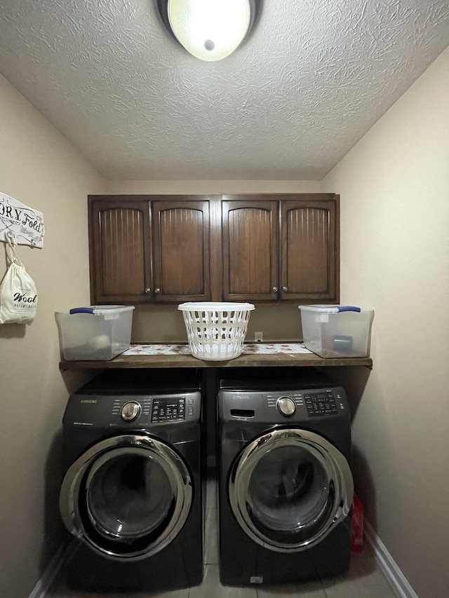 532 Douglas Ln, Lafayette, TN 37083 - washroom with washer and clothes dryer, cabinet space, tile patterned flooring, and a textured ceiling