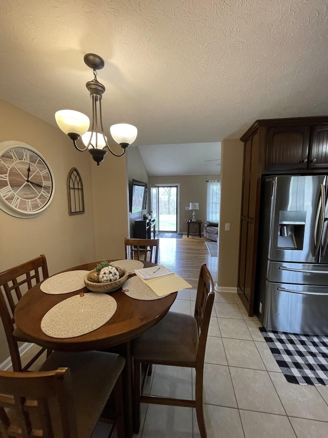 532 Douglas Ln, Lafayette, TN 37083 - dining area featuring light tile patterned floors and a textured ceiling