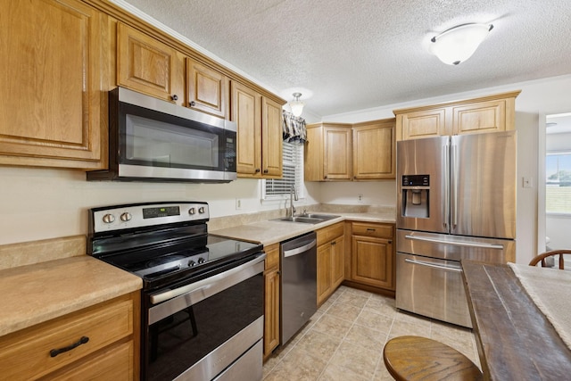 1710 New Highway 7, Columbia, TN 38401 - kitchen with appliances with stainless steel finishes, a textured ceiling, light tile patterned flooring, light countertops, and brown cabinets