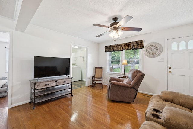 1710 New Highway 7, Columbia, TN 38401 - living area featuring light wood-style floors, a ceiling fan, washer / clothes dryer, and a textured ceiling