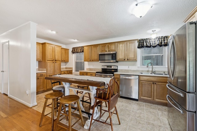 1710 New Highway 7, Columbia, TN 38401 - kitchen with appliances with stainless steel finishes, a textured ceiling, and light countertops