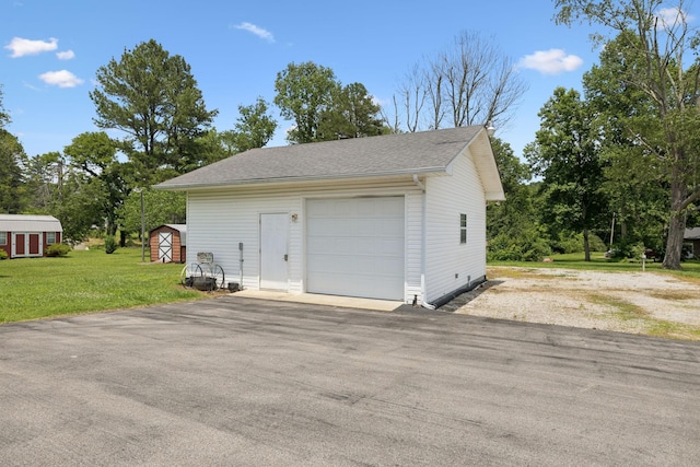 1710 New Highway 7, Columbia, TN 38401 - detached garage featuring asphalt driveway and a storage shed