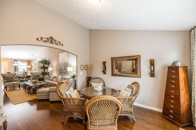 395 Devon Chase Hl Unit 3002, Gallatin, TN 37066 - dining room with arched walkways, dark wood-style floors, a chandelier, and a textured ceiling