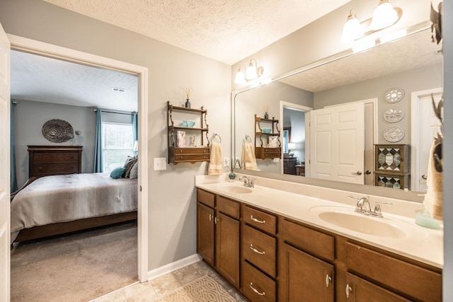 395 Devon Chase Hl Unit 3002, Gallatin, TN 37066 - bathroom with ensuite bath, a textured ceiling, double vanity, and tile patterned floors