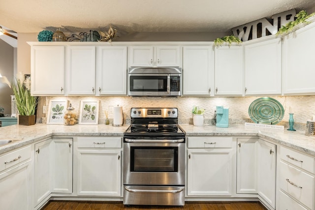 395 Devon Chase Hl Unit 3002, Gallatin, TN 37066 - kitchen with stainless steel appliances, white cabinetry, and a textured ceiling