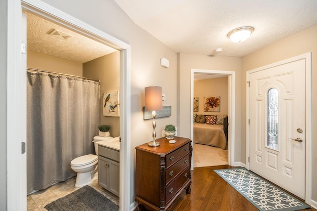 395 Devon Chase Hl Unit 3002, Gallatin, TN 37066 - foyer entrance featuring a textured ceiling and wood finished floors
