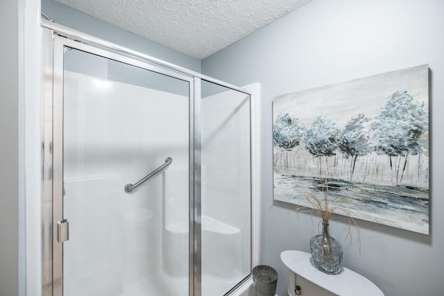 395 Devon Chase Hl Unit 3002, Gallatin, TN 37066 - bathroom featuring a stall shower and a textured ceiling
