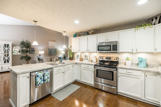 395 Devon Chase Hl Unit 3002, Gallatin, TN 37066 - kitchen featuring appliances with stainless steel finishes, a peninsula, backsplash, white cabinets, and recessed lighting