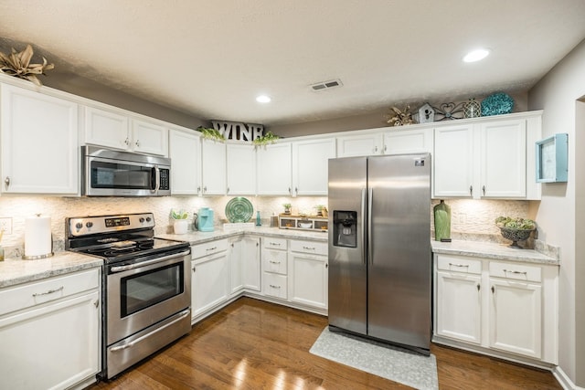 395 Devon Chase Hl Unit 3002, Gallatin, TN 37066 - kitchen featuring stainless steel appliances, white cabinetry, tasteful backsplash, dark wood-style floors, and recessed lighting