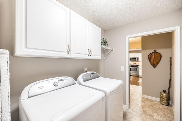 395 Devon Chase Hl Unit 3002, Gallatin, TN 37066 - laundry area featuring independent washer and dryer, cabinet space, and a textured ceiling