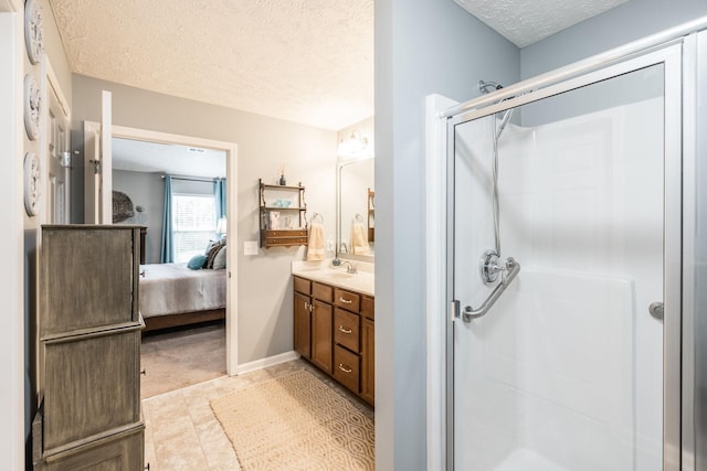 395 Devon Chase Hl Unit 3002, Gallatin, TN 37066 - full bath with a textured ceiling, vanity, a shower stall, connected bathroom, and tile patterned flooring