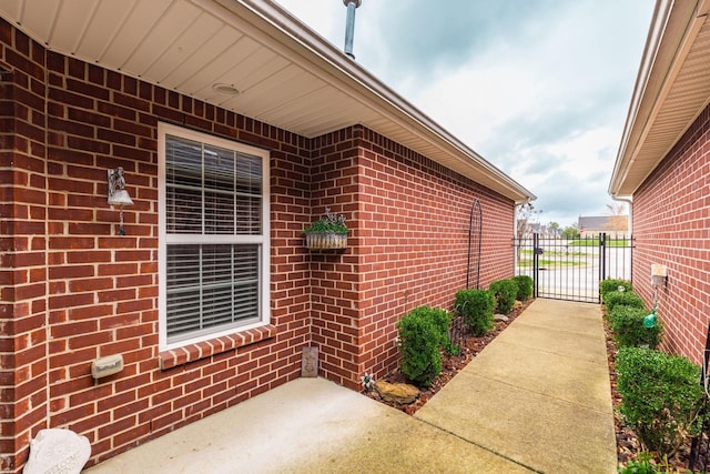 395 Devon Chase Hl Unit 3002, Gallatin, TN 37066 - view of home's exterior featuring brick siding and a gate