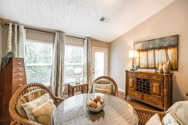 395 Devon Chase Hl Unit 3002, Gallatin, TN 37066 - dining space with vaulted ceiling, a textured ceiling, and wood finished floors