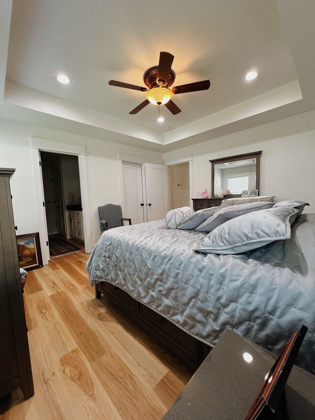 543 2nd Ave N, Lewisburg, TN 37091 - bedroom featuring a tray ceiling, light wood-type flooring, recessed lighting, and a ceiling fan