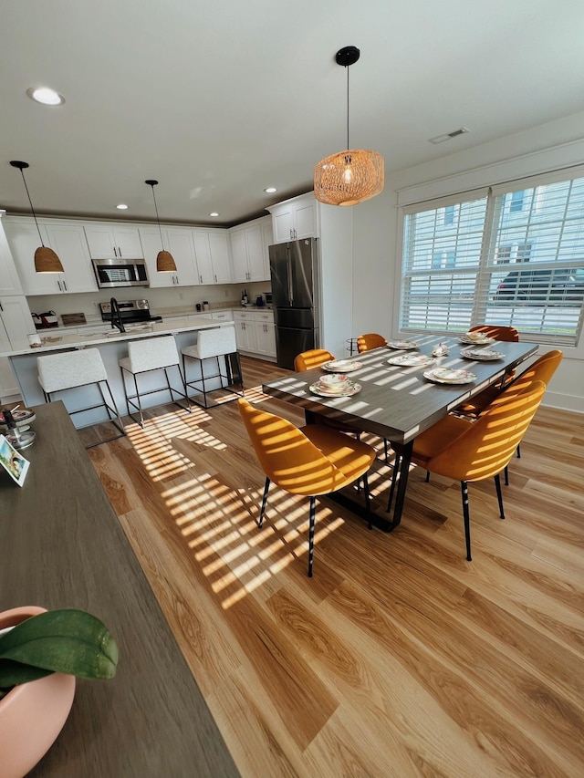 543 2nd Ave N, Lewisburg, TN 37091 - dining space featuring light wood-style flooring and recessed lighting