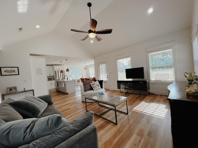 543 2nd Ave N, Lewisburg, TN 37091 - living area featuring ceiling fan, plenty of natural light, light wood-type flooring, and high vaulted ceiling