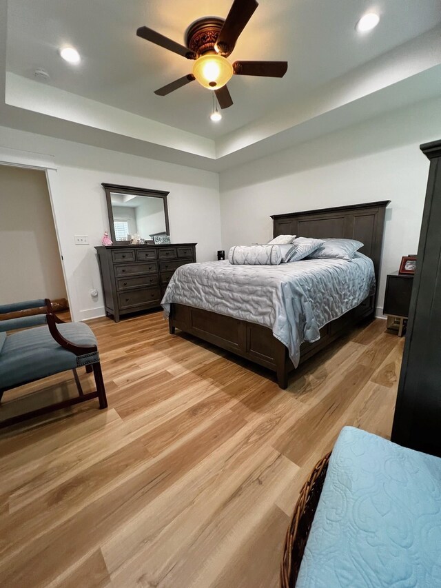 543 2nd Ave N, Lewisburg, TN 37091 - bedroom with a tray ceiling, light wood-style flooring, ceiling fan, and recessed lighting