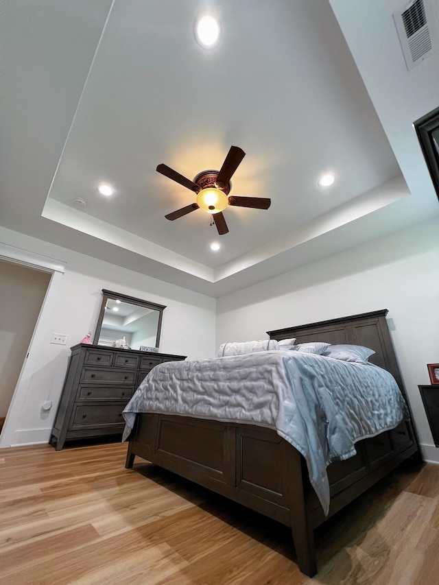 543 2nd Ave N, Lewisburg, TN 37091 - bedroom featuring a tray ceiling, light wood-style floors, recessed lighting, and ceiling fan