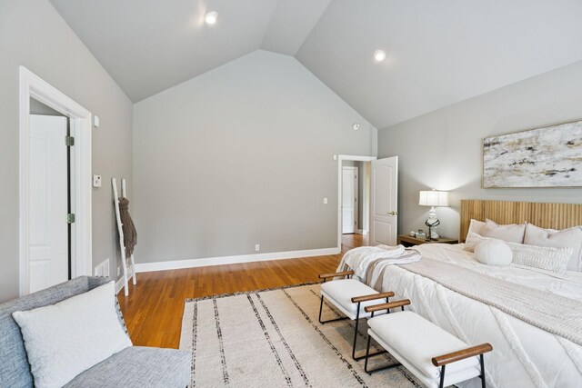 1387 Floyd Rd, Eagleville, TN 37060 - bedroom with high vaulted ceiling and wood finished floors