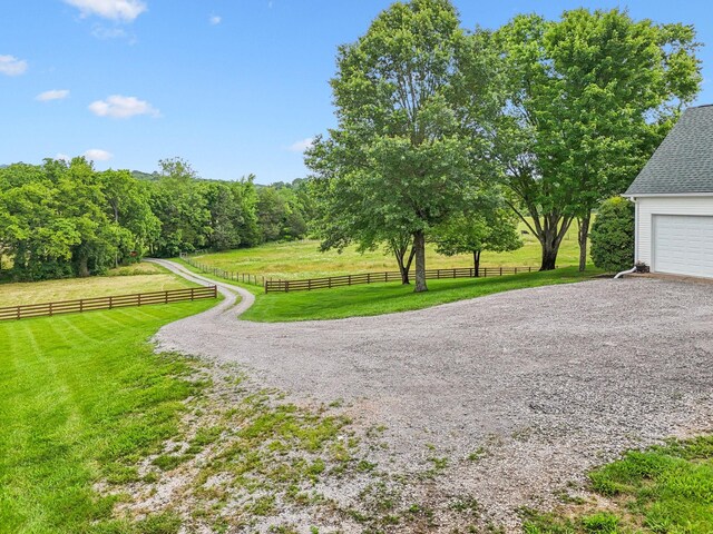 1387 Floyd Rd, Eagleville, TN 37060 - view of yard featuring a view of rural / pastoral area, a garage, and gravel driveway