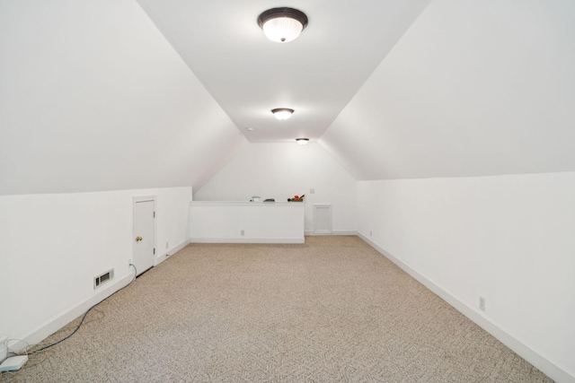 1387 Floyd Rd, Eagleville, TN 37060 - additional living space with light colored carpet and vaulted ceiling