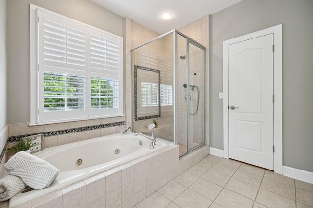 1387 Floyd Rd, Eagleville, TN 37060 - full bathroom featuring a tub with jets, a shower stall, and tile patterned floors