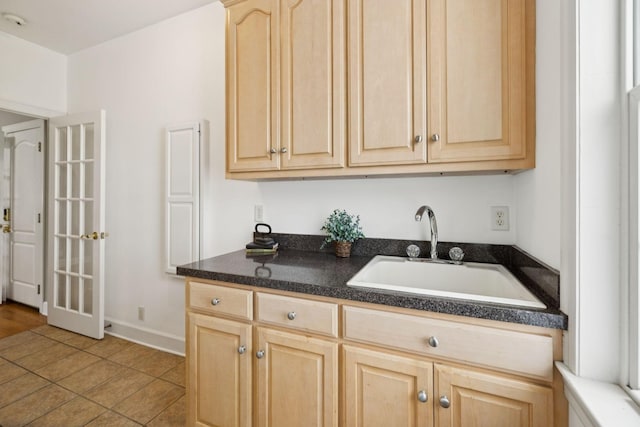 1387 Floyd Rd, Eagleville, TN 37060 - kitchen featuring light brown cabinetry, dark countertops, and light tile patterned floors