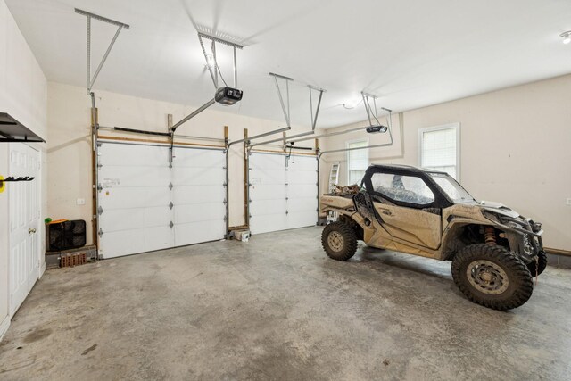 1387 Floyd Rd, Eagleville, TN 37060 - garage featuring a garage door opener