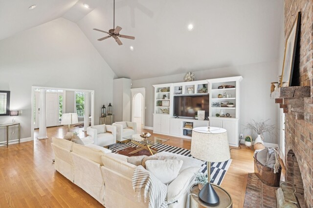1387 Floyd Rd, Eagleville, TN 37060 - living area with a fireplace, high vaulted ceiling, light wood-style floors, a ceiling fan, and recessed lighting