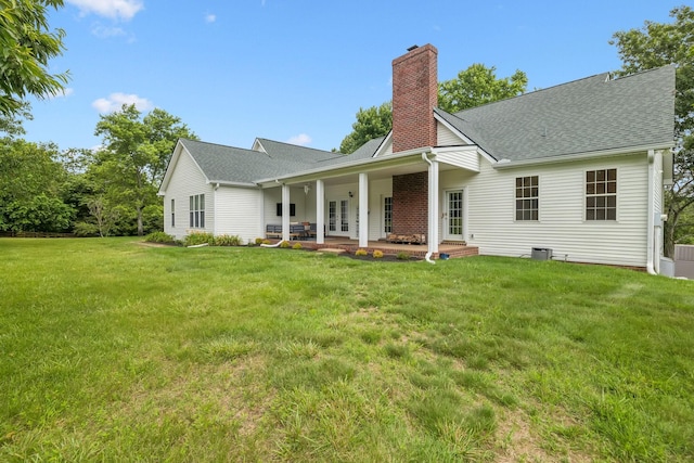 1387 Floyd Rd, Eagleville, TN 37060 - view of front of home with french doors, a chimney, a front lawn, and roof with shingles