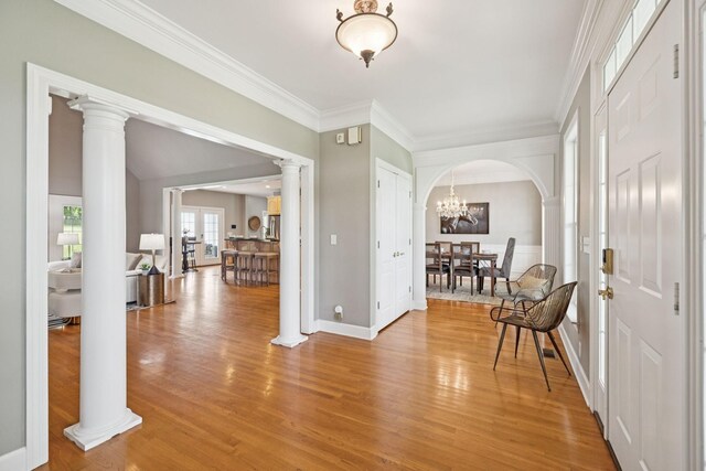 1387 Floyd Rd, Eagleville, TN 37060 - entrance foyer with crown molding, light wood finished floors, and arched walkways