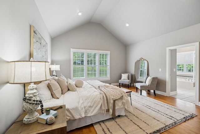 1387 Floyd Rd, Eagleville, TN 37060 - bedroom with wood finished floors, multiple windows, lofted ceiling, and ensuite bath