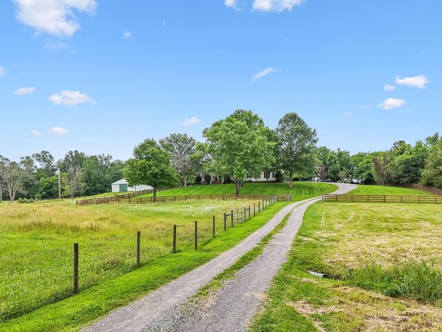 1387 Floyd Rd, Eagleville, TN 37060 - view of dirt / gravel driveway featuring a view of countryside