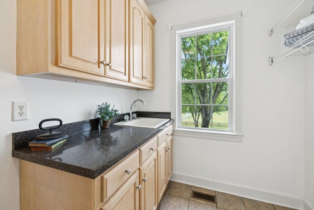 1387 Floyd Rd, Eagleville, TN 37060 - kitchen with light brown cabinets, plenty of natural light, and light tile patterned floors