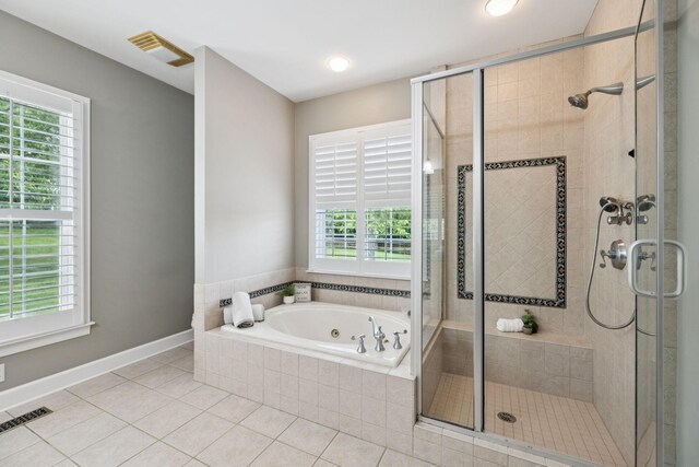 1387 Floyd Rd, Eagleville, TN 37060 - bathroom featuring a jetted tub, tile patterned floors, and a shower stall