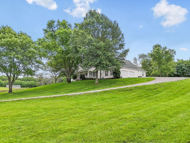 1387 Floyd Rd, Eagleville, TN 37060 - view of property hidden behind natural elements featuring a garage, a front yard, and driveway