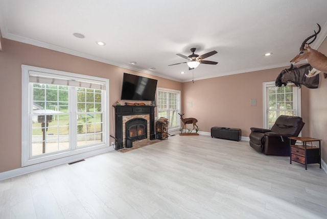 118 Stonebridge, Selmer, TN 38375 - living room featuring healthy amount of natural light, a ceiling fan, light wood-style flooring, recessed lighting, and ornamental molding