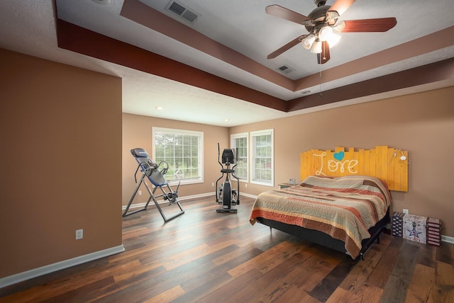 118 Stonebridge, Selmer, TN 38375 - bedroom with wood finished floors, a raised ceiling, and ceiling fan