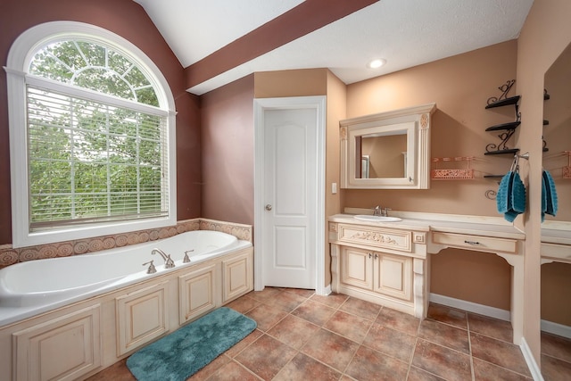 118 Stonebridge, Selmer, TN 38375 - full bathroom featuring a bath, vanity, lofted ceiling, and tile patterned floors