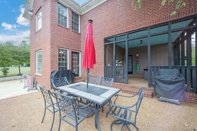 118 Stonebridge, Selmer, TN 38375 - view of patio with area for grilling and outdoor dining area