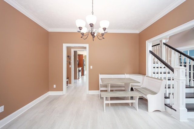 118 Stonebridge, Selmer, TN 38375 - dining space with a chandelier, ornamental molding, wood finished floors, and stairway
