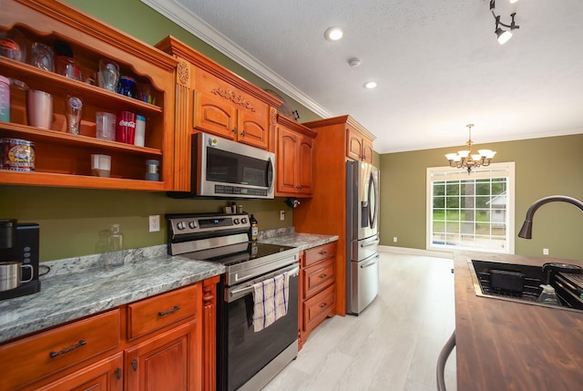 118 Stonebridge, Selmer, TN 38375 - kitchen with appliances with stainless steel finishes, crown molding, a chandelier, light wood-style flooring, and pendant lighting