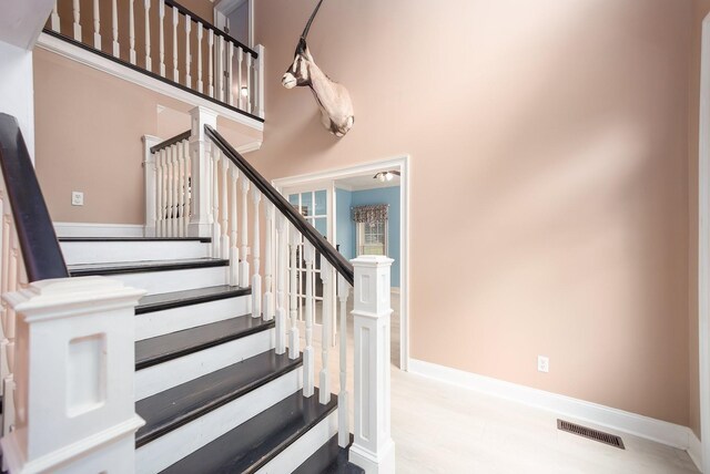 118 Stonebridge, Selmer, TN 38375 - staircase with wood finished floors and a towering ceiling